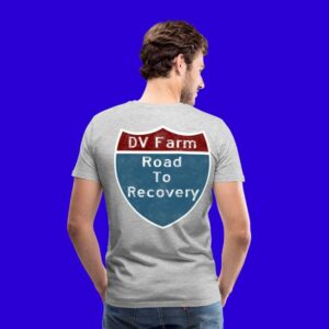 Man facing with back to us wearing the road to recovery t-shirt showing the back with the interstate sign.